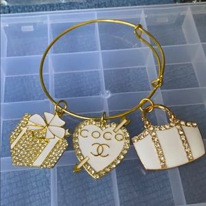 Gold plated bangle with charms